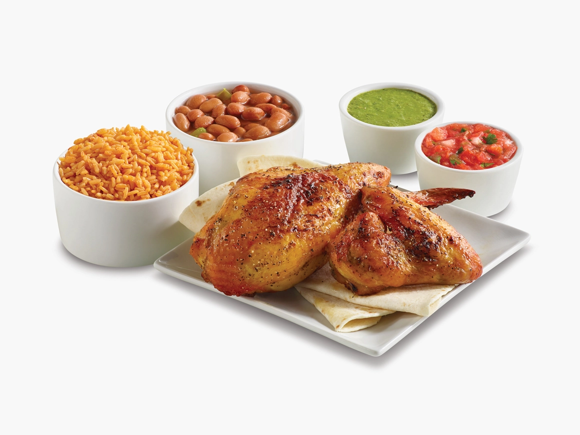 Two pieces of chicken with side of beans, rice, tortillas, and pico de gallo
