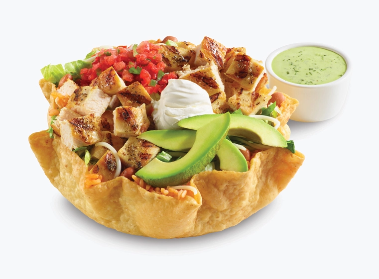 Double Chicken Tostada in tostada shell topped with avocado