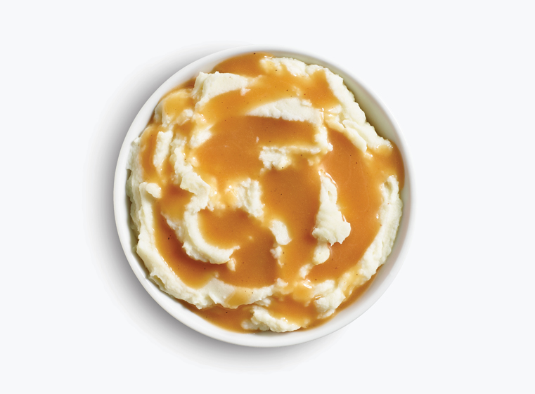 Bowl of mashed potatoes and gravy