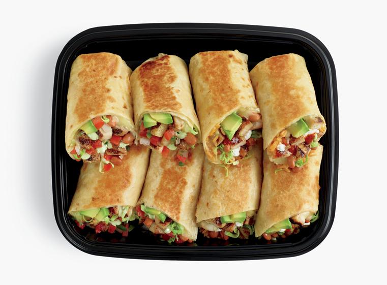Open catering container of burrito halves