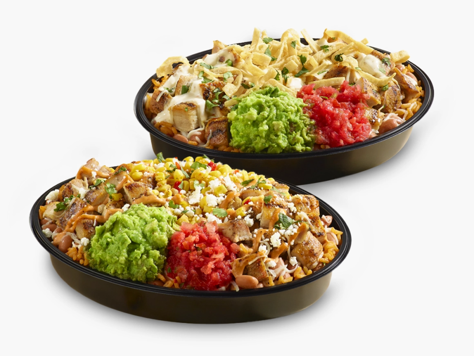 two burrito bowls in black bowls. Street corn double burrito bowl and queso crunch double burrito bowl.