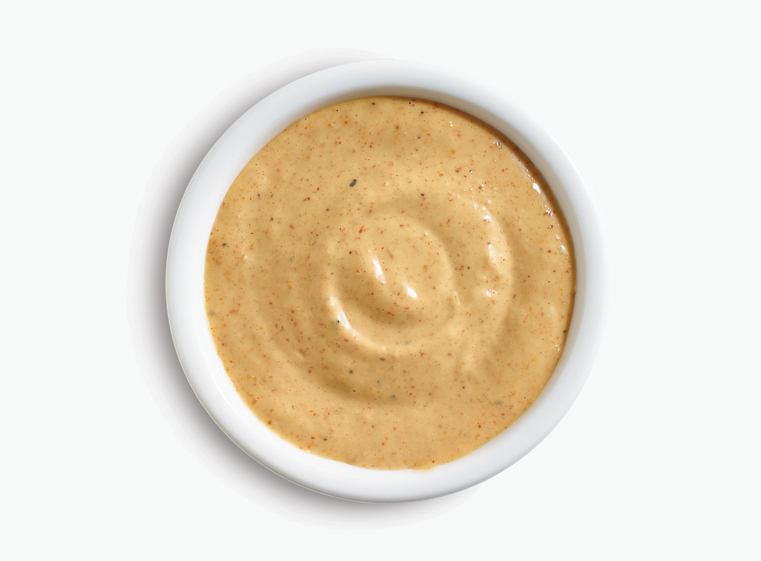 mexican caesar dressing in a white ramekin