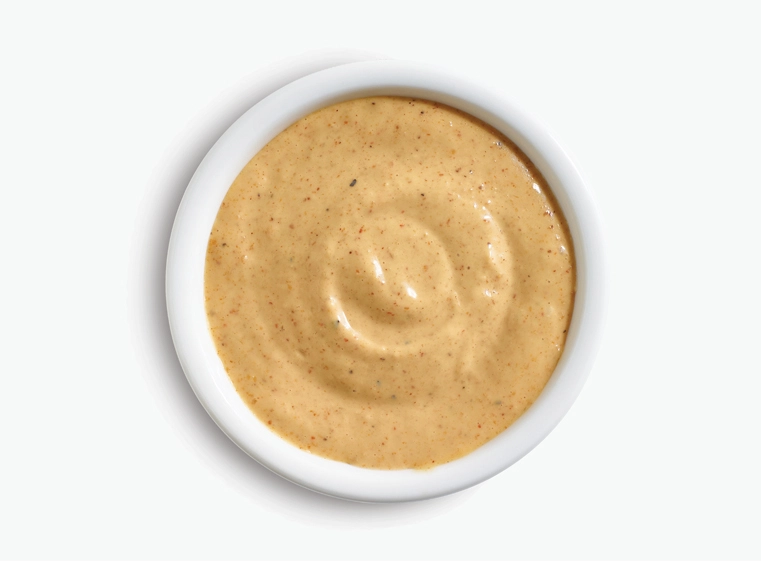 mexican caesar dressing in a white ramekin