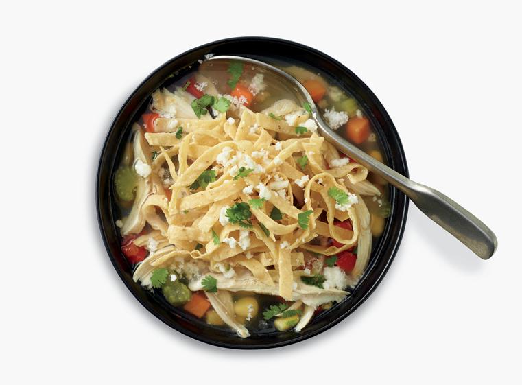 Bowl of homemade tortilla soup with spoon