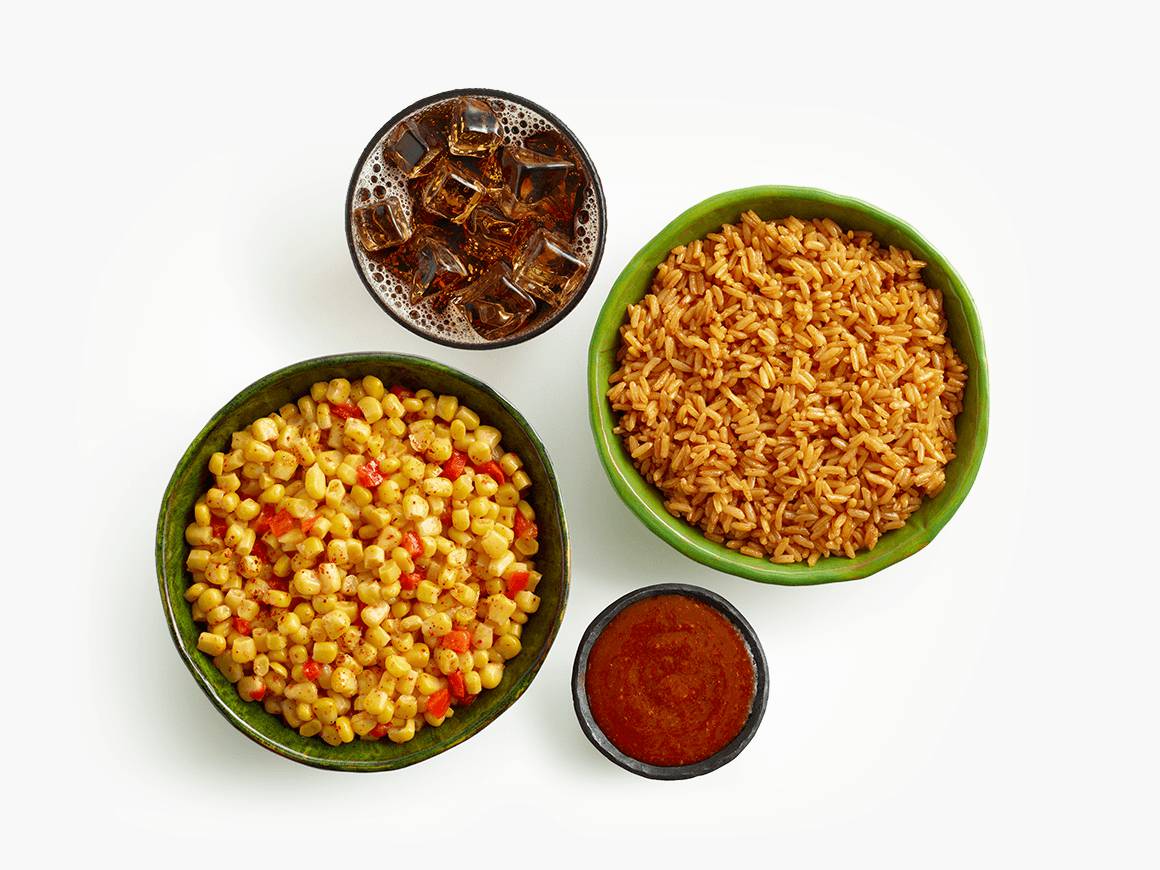 Bowls of rice, corn, salsa, and glass of cola