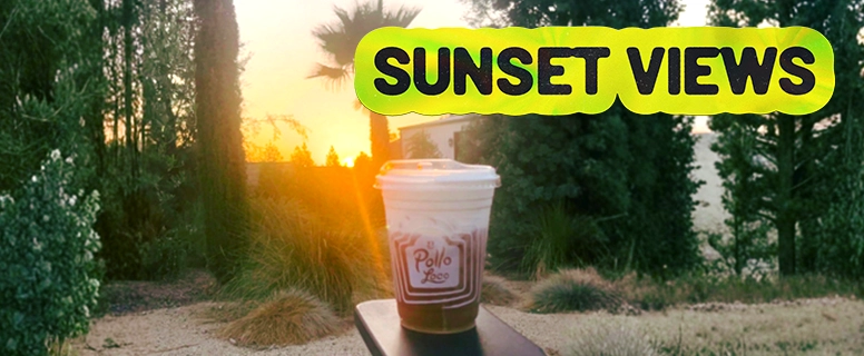 Sunset-views-challenge-chatacoffee-1.webp Drink held up against a golden hour sky